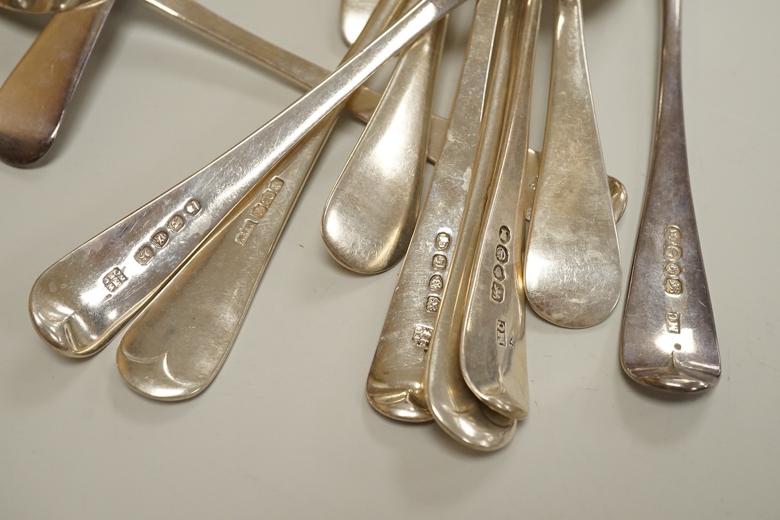Eleven assorted 19th century silver Old English pattern dessert spoons, various dates and makers, 15.5oz.
